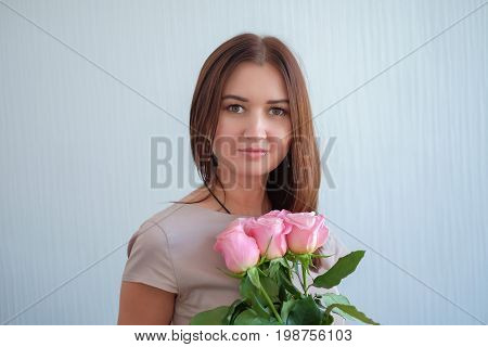 young woman with a bouquet of roses