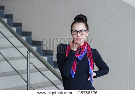Woman kissing a woman blowing a kiss, a woman sending an air kiss on stairs