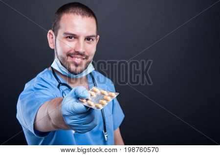 Selective Focus Of Doctor Wearing Scrubs Handing Tablets