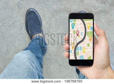 hand holding smart phone with map gps navigation application. concept guideline street travel