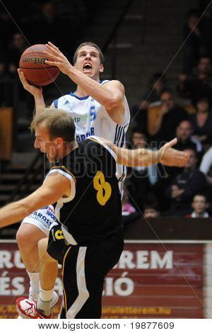 KAPOSVAR, HUNGARY - NOVEMBER 13: Vojvoda (9) and Kalman (8) in action at Hungarian National Championship basketball game Kaposvar vs Szombathely November 13, 2009 in Kaposvar.