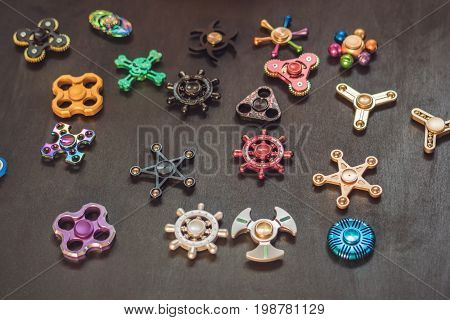 A Lot Of Different Spinners On A Black Background