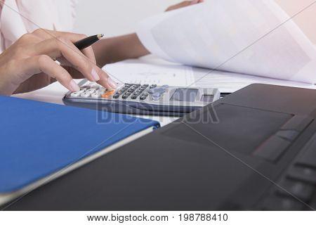 Businesswoman calculate about cost and doing finance at home office Finance managers taskConcept business and finance investment