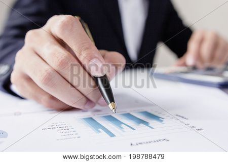 Businessmen working with graph data at officeFinance managers taskConcept business and finance investment