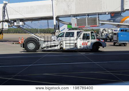 Pushback tractor for moving luggage at the international airport of Antalya - July 2017.