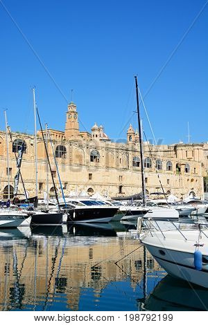 VITTORIOSA, MALTA - MARCH 31, 2017 - View of the Senglea waterfront buildings seen from Vittoriosa (Birgu) Malta Europe, March 31, 2017.