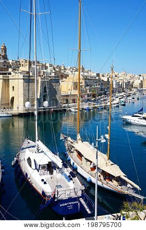 VITTORIOSA, MALTA - MARCH 31, 2017 - Elevated view of yachts moored in the marina with views towards Senglea Vittoriosa Malta Europe, March 31, 2017.