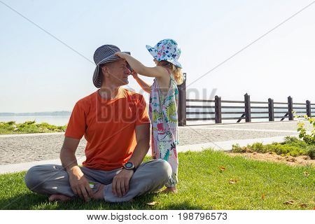 Little Girl Is Playing With Her Father