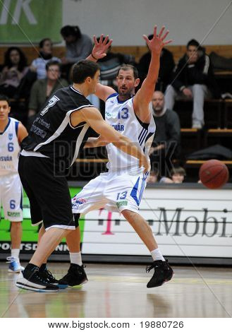 KAPOSVAR, HUNGARY - MARCH 6: Laszlo Orosz (R) in action at a Hugarian Champonship basketball game Kaposvar vs. Pecsi VSK March 6, 2010 in Kaposvar, Hungary.