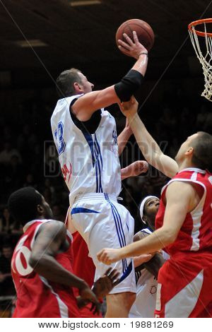 KAPOSVAR, HUNGARY - MARCH 27: Laszlo Orosz (C) in action at a Hugarian Champonship basketball game Kaposvar vs. Kecskemet March 27, 2010 in Kaposvar, Hungary.