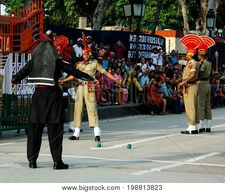 The marching Pakistani and Indian guards in national uniform at the ceremony of lowering the flags - 04-05-2015 border between Pakistan and India Wagah Lahore Pakistan