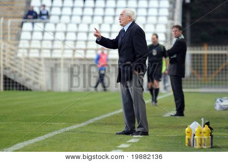 KAPOSVAR, HUNGARY - APRIL 17: Jozsef Garami, MTKÃ¢??s trainer (C) in action at a Hungarian National Championship soccer game Kaposvar vs MTK Budapest April 17, 2010 in Kaposvar, Hungary.