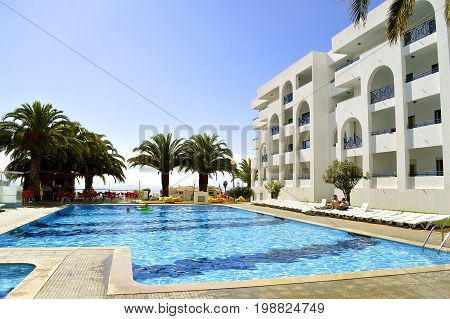 Senhora Da Rocha Algarve Portugal - October 7 2014 : Tourists in the swimming pool in Senhora Da Rocha Portugal