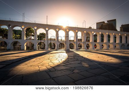 Sun Shines Through Landmark Lapa Arch in Rio de Janeiro City Downtown