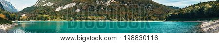 Panorama of Lago di Tenno - lake with turquoise water in Tenno Trentino Italy.
