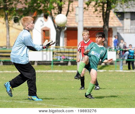 KAPOSVAR, HUNGARY - MAY 9: Aron Laszlo (L) in action at the Hungarian National Championship under 13 game between Kaposvari Rakoczi and Nagykanizsa May 9, 2010 in Kaposvar, Hungary.