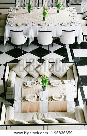 Stylish Black And White Dining Tables And Chairs. Minimalist Interior In Monochrome. Empty Restauran