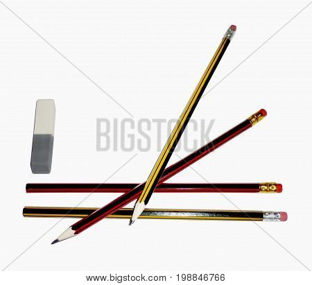 three pencils with an eraser isolated on a white background