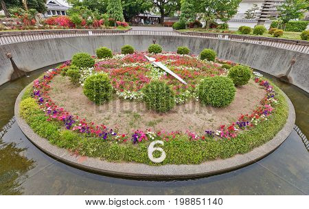 OKAZAKI JAPAN - MAY 31 2017: Flower Clock in in Okazaki Castle Aichi Prefecture Japan. Created in 1960 moved by a direct current motor of 1/10 horse power