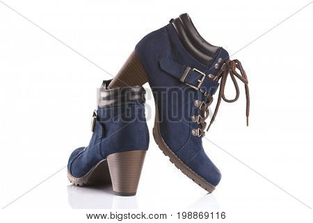Dark blue boots with bootlaces, isolated on white background 