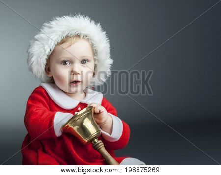 portrait of cute female caucasian child with santa claus clothes