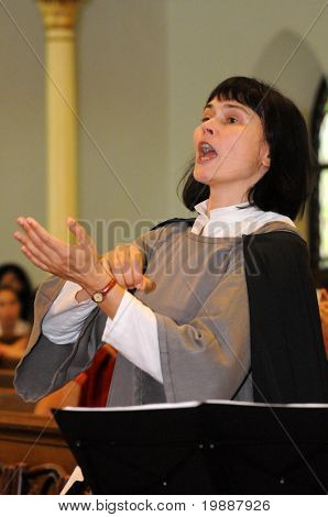 KAPOSVAR, HUNGARY - AUGUST 26: Kardi Hunt conducts at the IV. Pannonia Cantat Youth Choir Festival August 26, 2010 in Kaposvar, Hungary