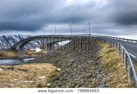Travel Destinations and Sights. Partial View of Ascending Famous and Renowned Fredvang Bridge in Norway at Lofoten Islands. Shot from Low Point. Horizontal Image Orientation