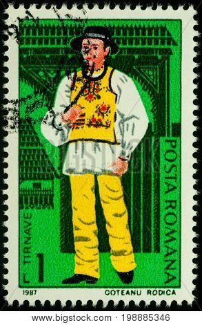 Moscow Russia - August 07 2017: A stamp printed in Romania shows young man in Romanian national costume Tarnave region series 