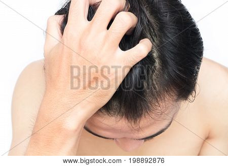 Closeup man hand itchy scalp Hair care concept