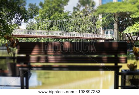 Wooden bench in a water house garden stock photo