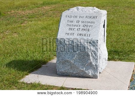 KILL DEVIL HILLS, NORTH CAROLINA - JULY 14, 2017:  Stone marker indicating the landing site of the first successful flight by Wilbur and Orville Wright at the Wright Brothers National Memorial.
