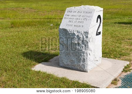 KILL DEVIL HILLS, NORTH CAROLINA - JULY 14, 2017:  Stone marker indicating the landing site of the second successful flight by Wilbur and Orville Wright at the Wright Brothers National Memorial.