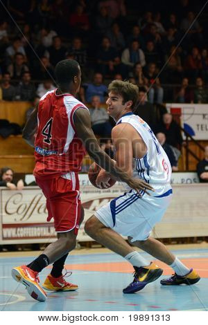 KAPOSVAR, HUNGARY - NOVEMBER 27: Dan Werner (R) in action at a Hungarian Championship basketball game Kaposvar vs. Kormend November 27, 2010 in Kaposvar, Hungary.