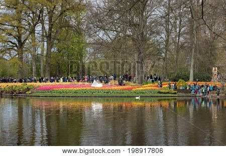 LISSE NETHERLANDS - APRIL 19 2017: Visitors at the Keukenhof Garden in Lisse Holland Netherlands.