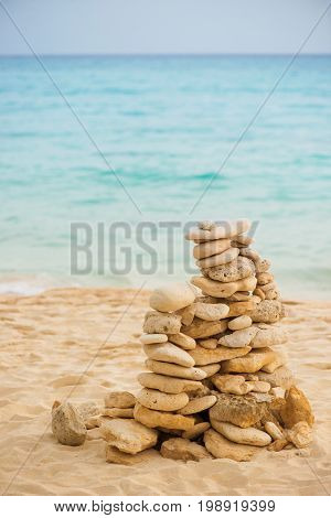 Balance stone on sea coast. Zen rocks on the beach. Feng Shui balance.