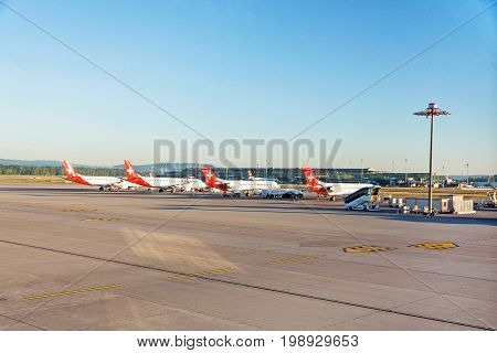 Zurich Switzerland - June 11 2017: Airport Zurich (Flughafen Zurich) - view of airfield with several planes of airline "swiss" in parking position