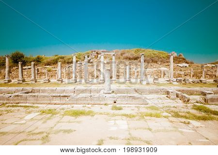Ancient ruins of Perge. The colonnaded street. Stylized color film. Toning. Turkey