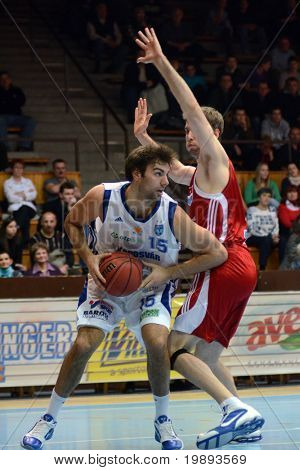 KAPOSVAR, HUNGARY - JANUARY 12: Dan Werner (L) in action at a Hugarian Cup basketball game Kaposvar vs. Paks January 12, 2011 in Kaposvar, Hungary.