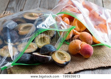 Frozen plums and apricots in a bag