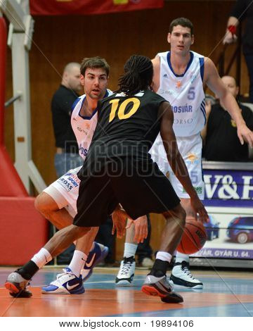 KAPOSVAR, HUNGARY - JANUARY 22: Dan Werner (L) in action at a Hungarian National Championship basketball game Kaposvar vs Szombathely January 22, 2011 in Kaposvar.