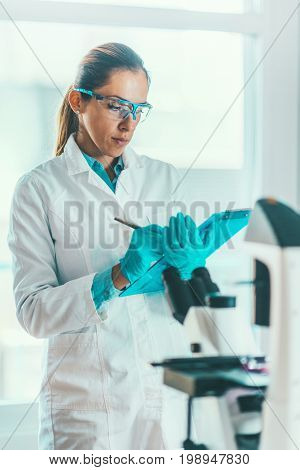 Scientist Researching In Laboratory, Toned Image, Selective Focus
