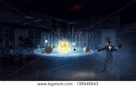 Businessman demonstrating magic . Mixed media