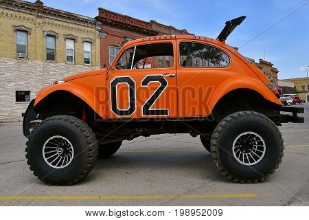 CASSELTON, NORTH DAKOTA, July 27, 2017: The annual Casselton Car Show which occurs the last Thursday of July features classic vehicles such as the restored 1960's Volkswagen Bug in oversized tires.