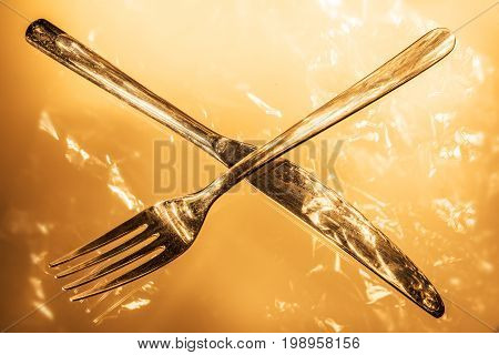 Fork and knife with reflections and light effects