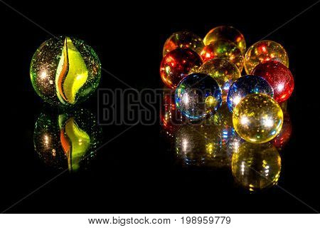 Mirrored colourful glass beads on black background