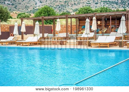 Relaxation area around the swimming pool on the Greek resort Crete