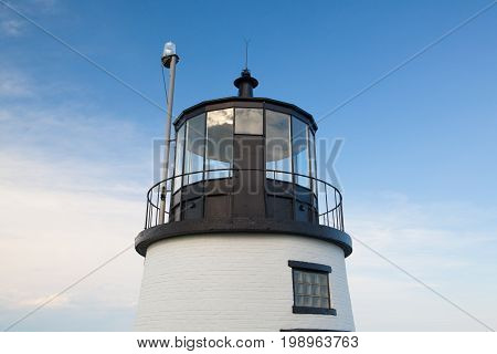 Small Castle Hill lighthouse in Newport Rhode Island overlooking the Atlantic Ocean built in 1830