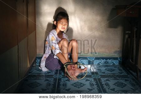 Asian human trafficking concept.Rope tied the hands of Thai girls.