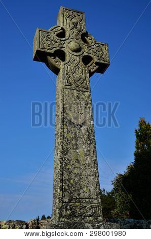 A View Of A Stone Celtic Cross Headstone In A Graveyard In The Perthshire Town Of Blackford Near Gle