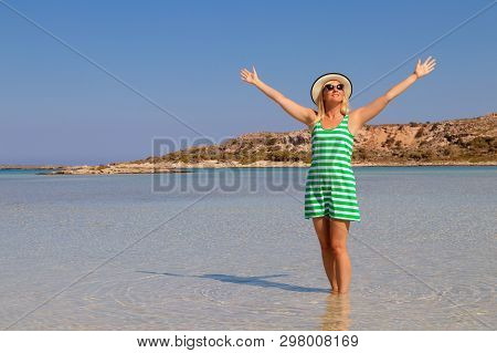Free Happy Woman In Green Striped Dress Enjoying Relaxing Beach, Joyful In Summer By Tropical Blue W